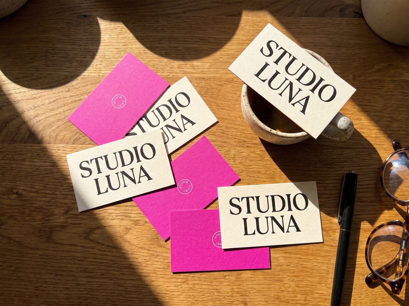 Laminated business cards spread on a desk