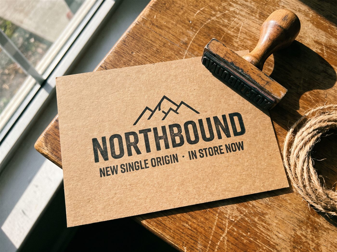 A commercial kraft postcard for a coffee roastery printed in bold black ink