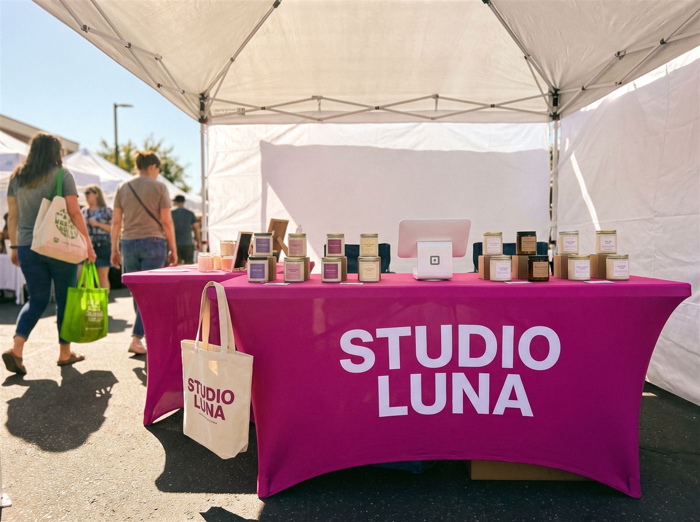 Magenta printed table cover at a craft fair