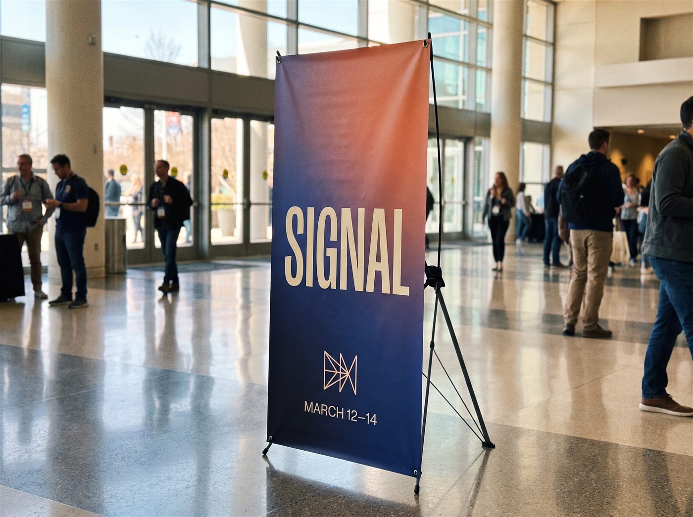 A tall SIGNAL X-frame banner standing on its slim folding X support in a bright conference foyer